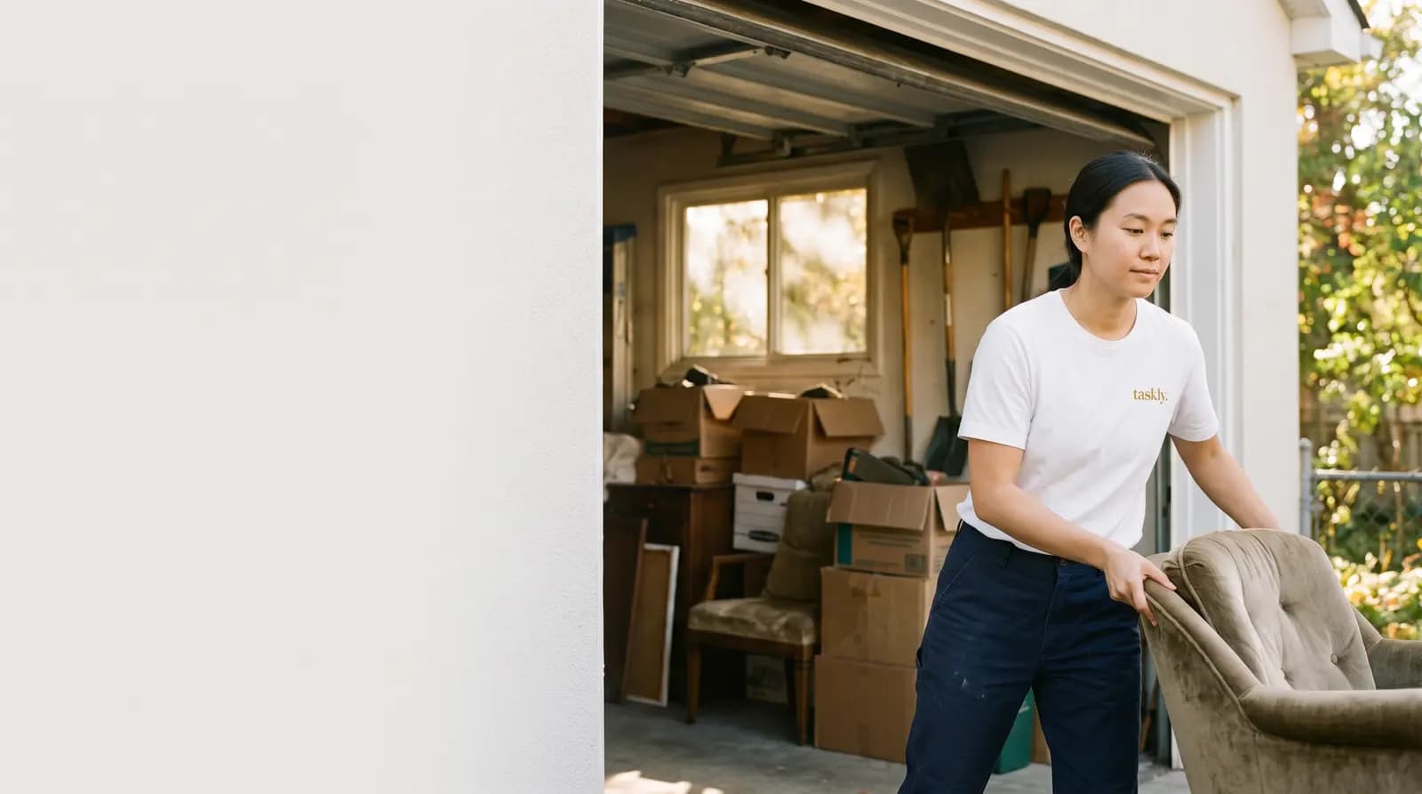 A garage being cleared of stored boxes and unwanted furniture in a Toronto home.